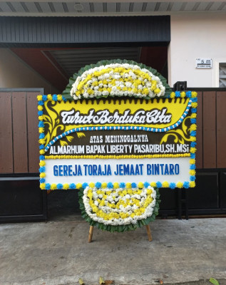Papan Bunga Duka di Wera